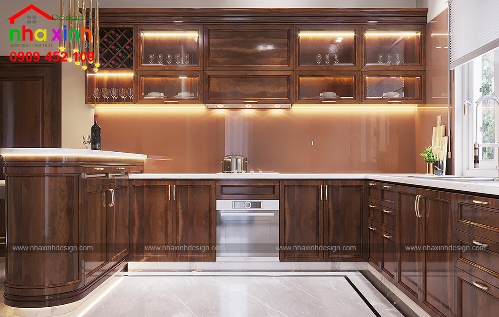 Phòng bếp được khéo léo kết hợp hệ tủ gỗ thông minh có màu nâu trầm để tạo điểm nhấn