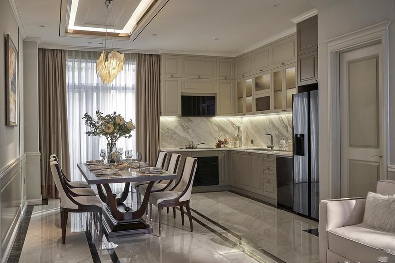 Phòng khách và phòng bếp được thiết kế nối liền với nhau để tăng thêm diện tích trống