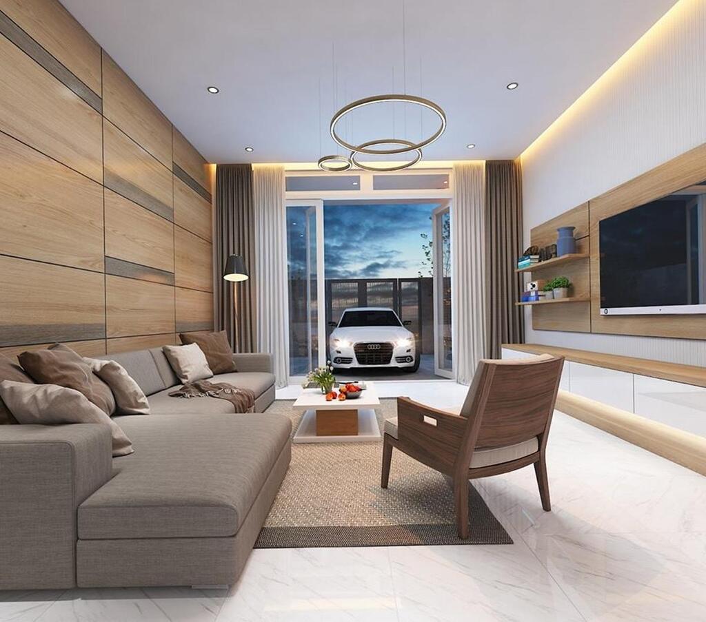 Nội thất tối giản cùng tone màu gỗ toát lên vẻ hiện đại cho phòng khách có chiều ngang hẹp