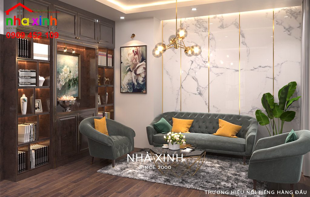 Phòng sinh hoạt chung đầy ấm cúng với bộ sofa xanh rêu sang trọng, tạo điểm nhấn với gối tựa màu vàng